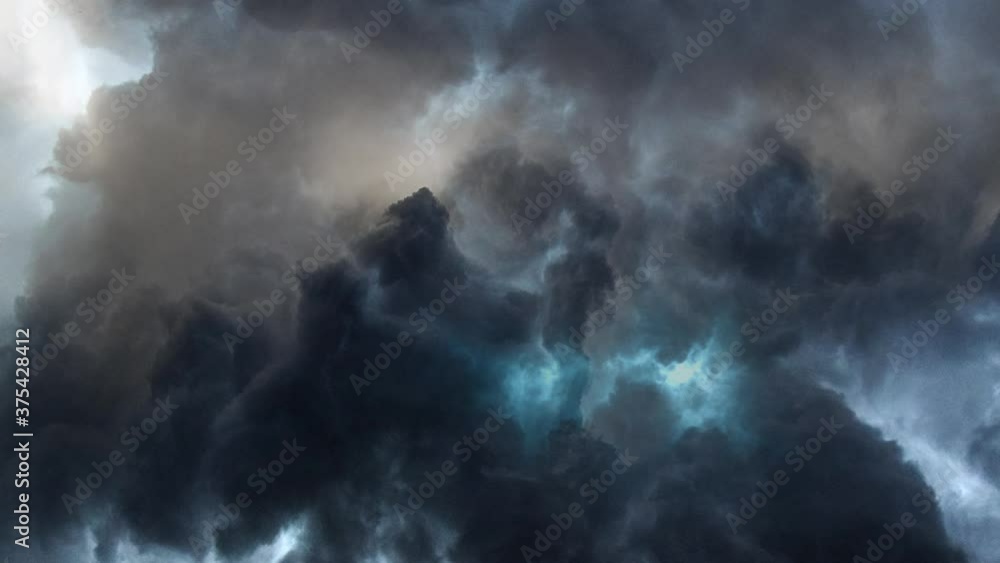 dark clouds and a thunderstorm within dark clouds and a thunderstorm within