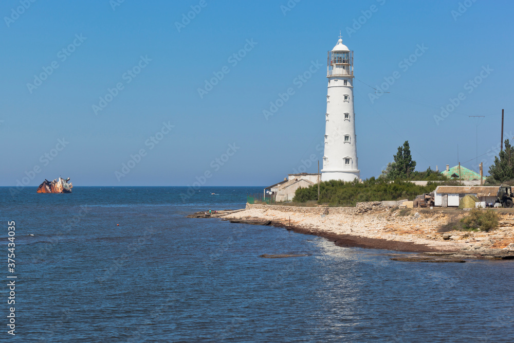 Tarkhankut lighthouse and dry-cargo ship Ibragim Yakim stranded by a storm, Crimea