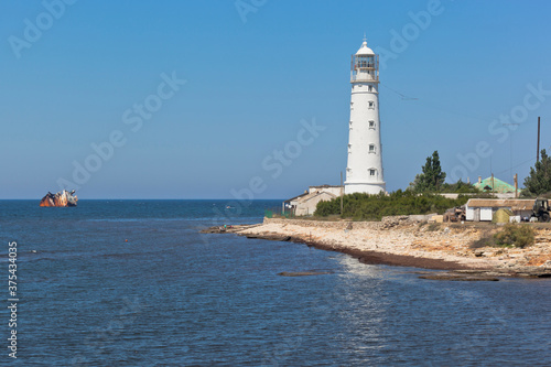 Tarkhankut lighthouse and dry-cargo ship Ibragim Yakim stranded by a storm, Crimea