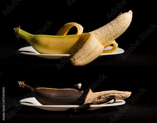 Photography Composition Two bananas in plates - fresh and rotten