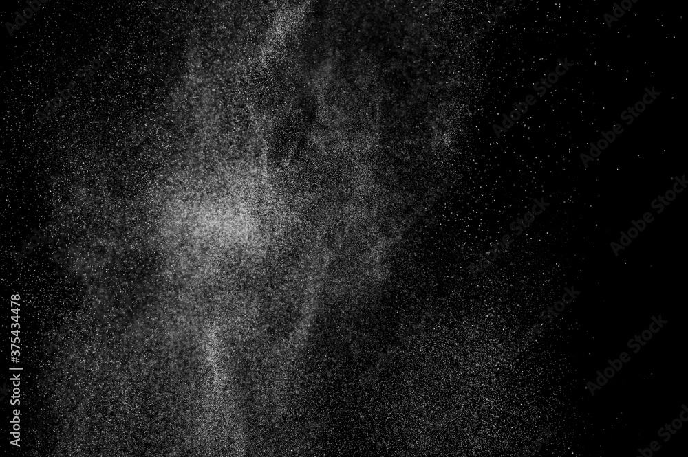 Abstract splashes of water on black background. Freeze motion of white particles. Rain, snow overlay texture. Abstract splashes of water on black background. Freeze motion of white particles. Rain, snow overlay texture.