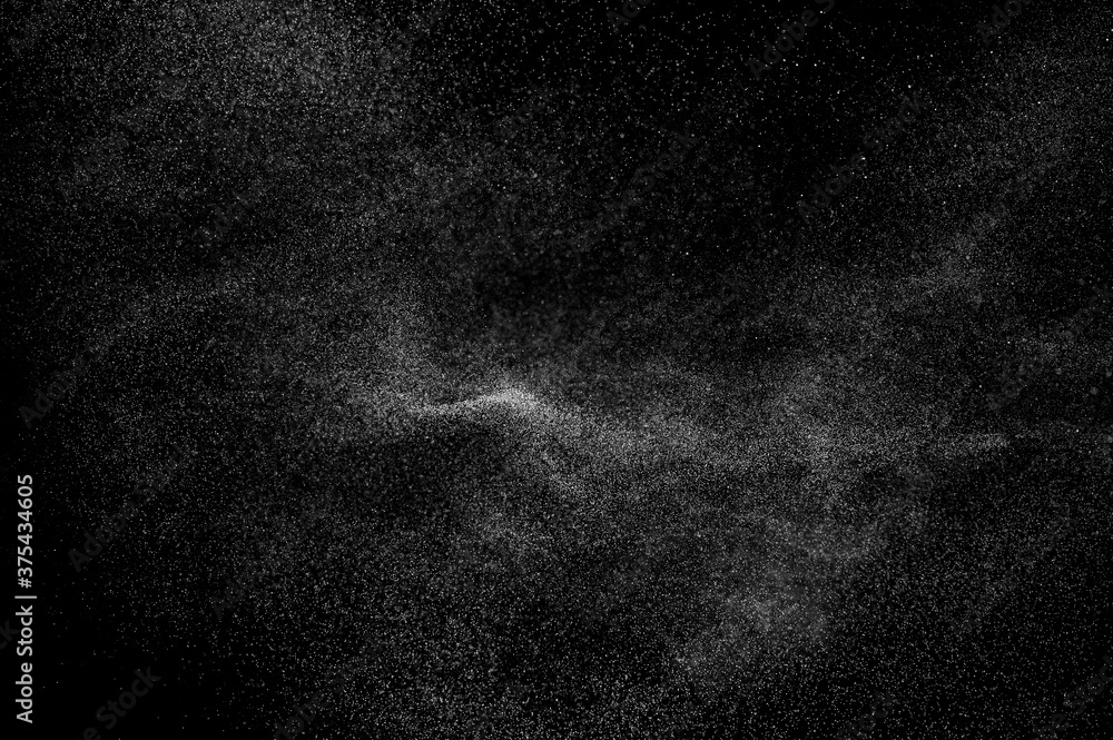 Abstract splashes of water on black background. Freeze motion of white particles. Rain, snow overlay texture. Abstract splashes of water on black background. Freeze motion of white particles. Rain, snow overlay texture.