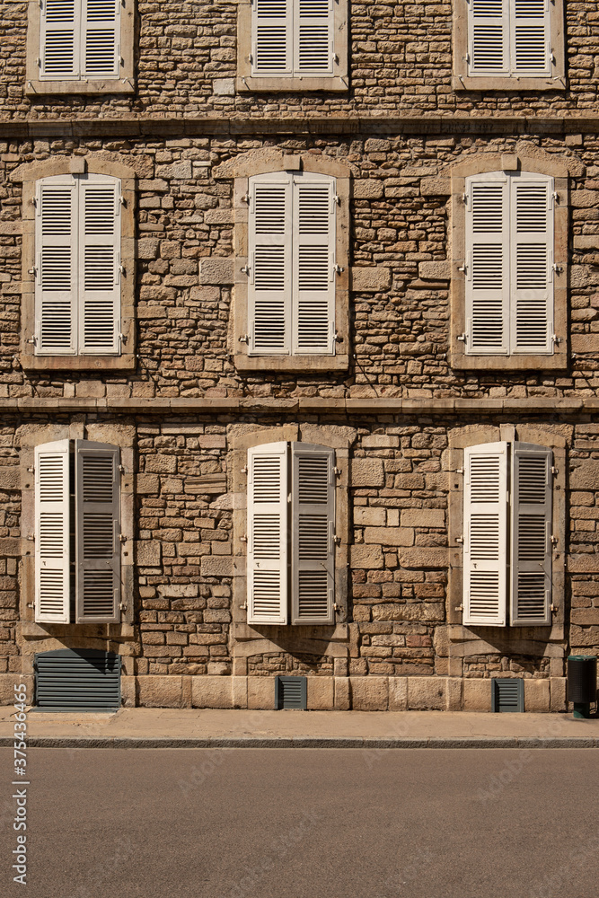 A house in France and characteristic window shutters 