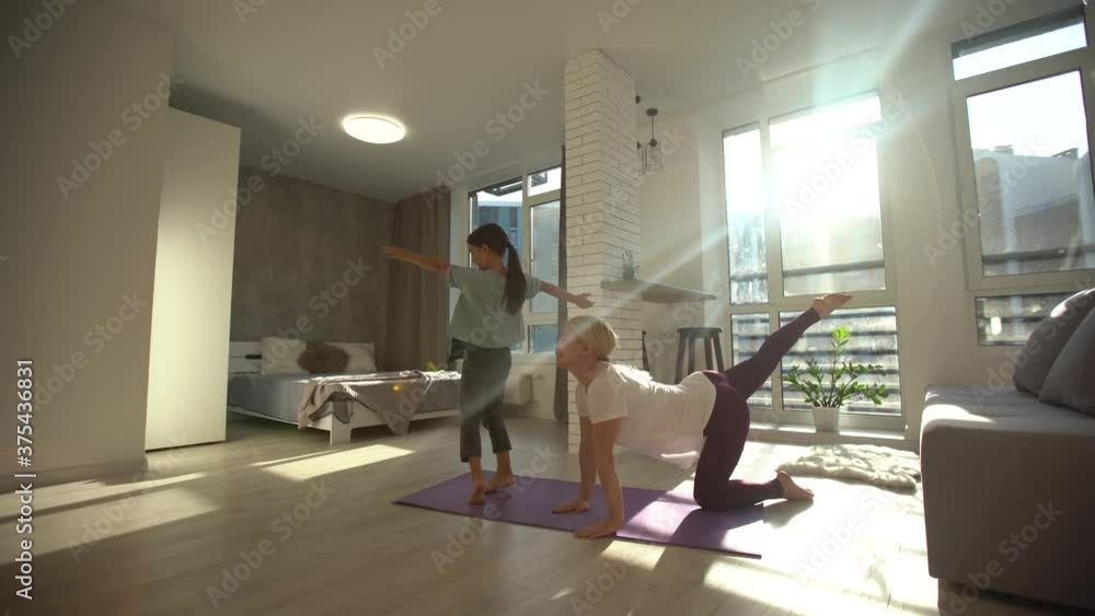 Laughing little girl doing daily warm up at home Laughing little girl doing daily warm up at home