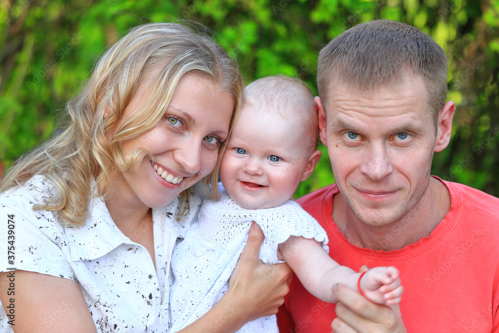 Fototapeta premium Dad and daughter in the park. Portrait of dad and child.