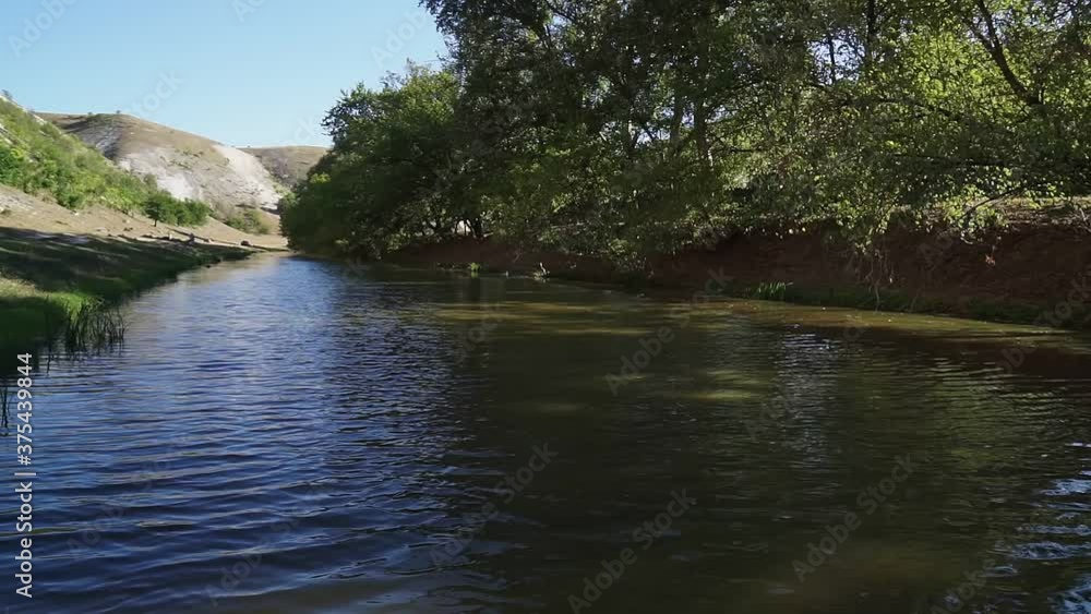 Beautiful river, a lot of greenery and trees, a beautiful reflection in the water. Beautiful river, a lot of greenery and trees, a beautiful reflection in the water.