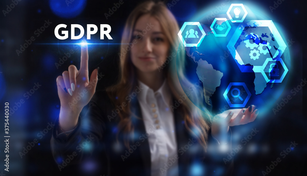 Business, Technology, Internet and network concept. Young businessman working on a virtual screen of the future and sees the inscription: GDPR Business, Technology, Internet and network concept. Young businessman working on a virtual screen of the future and sees the inscription: GDPR