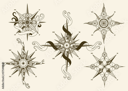 Collection of vintage nautical compass. Old vector design elements for marine theme and heraldry. Hand drawn wind roses