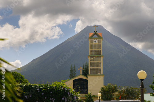 La Fortuna de San Carlos Catholic church tower with Arenal volcano Costa Rica photo