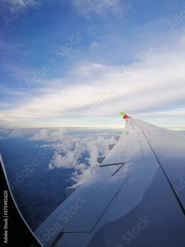 Flying on an airplane in the blue sky.