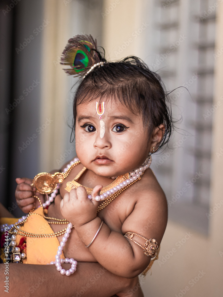 Child dressed as krishna cheap