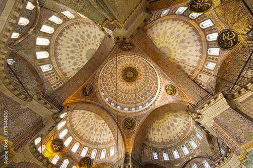 Domes of the Historical New Mosque known also as Yeni Cami mosque in Istanbul, Turkey photo