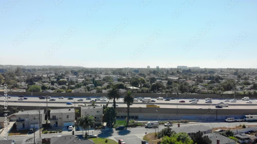 Aerial view along 405 freeway in Los Angeles California with traffic, on a sunny day, in Los Angeles, California, USA Aerial view along 405 freeway in Los Angeles California with traffic, on a sunny day, in Los Angeles, California, USA