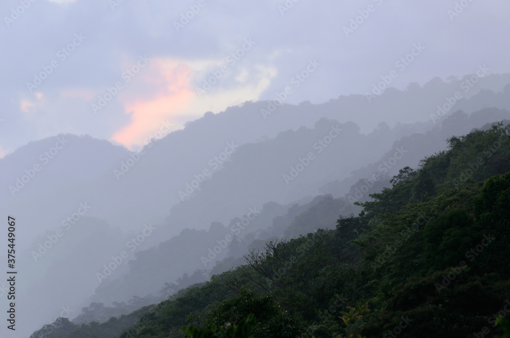 Receding hills on the Osa Peninsula coast at dusk in Costa Rica