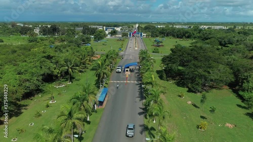 National Flag Waves as Cars Passing Through the Security Checkpoint Entry to Base Aerea, Head Quarters to the Dominican Republic Air Force, Drone Aerial photo