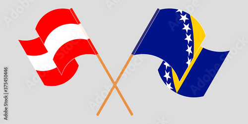 Crossed and waving flags of Bosnia and Herzegovina and Austria