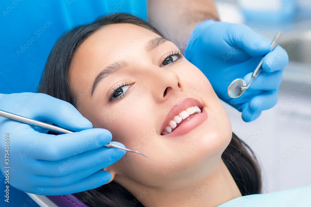 dentist examines the patients teeth at the dentist. dentist examines the patients teeth at the dentist.
