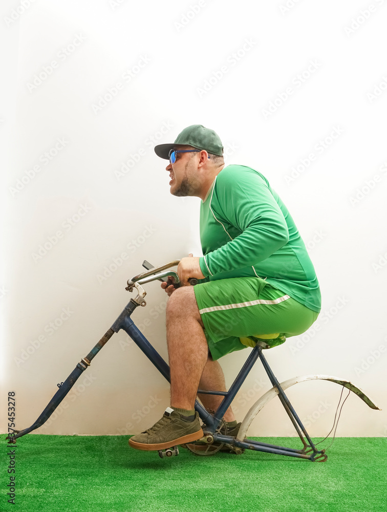 Man Riding bicycle without wheels on white Wall Background. Set as