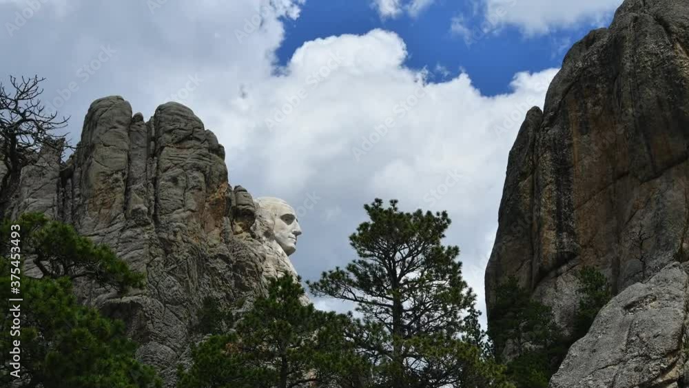 Profile of President Washington at Mount Rushmore with a timelapse of clouds moving left to right. Camera is locked. Profile of President Washington at Mount Rushmore with a timelapse of clouds moving left to right. Camera is locked.