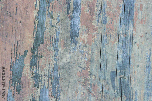 Grunge wall with cracks and peeling paint. Textured background. Old Wood texture