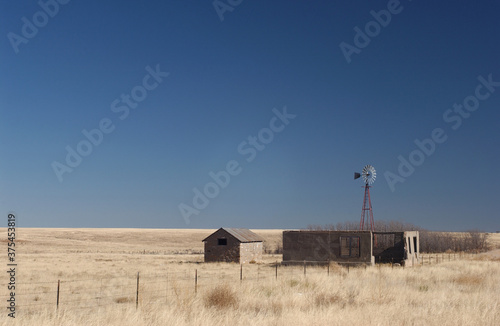 Abandoned homestead and windmill