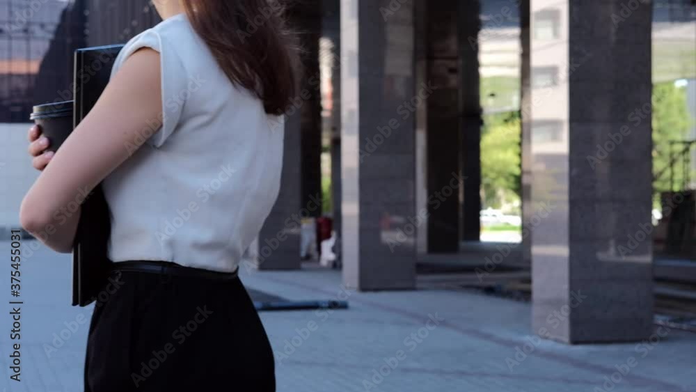 Confident business woman, near office, holding coffee, smiling, independent executive woman enjoying successful corporate career Confident business woman, near office, holding coffee, smiling, independent executive woman enjoying successful corporate career