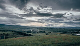 Sunset landscape with rain clouds over the Mexican countryside and a town called Almoloya de Juaréz