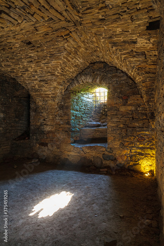 Rays of light shining into the medieval cellar