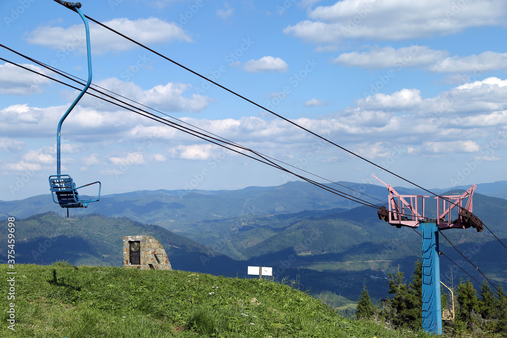 mountain lift against the backdrop of a summer mountain landscape
