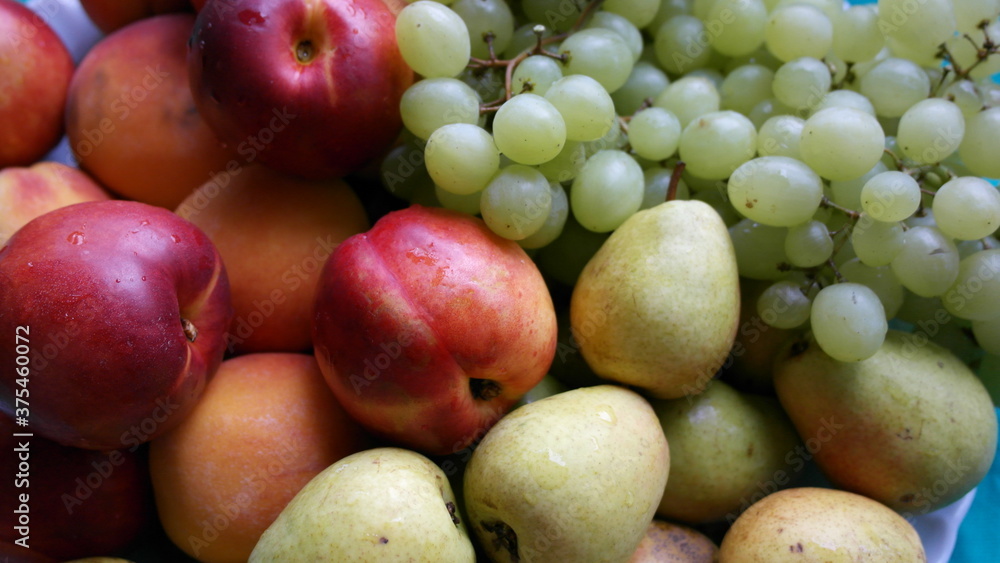 Nectarines, pears, peaches, green grapes close-up. Nectarines, pears, peaches, green grapes close-up.