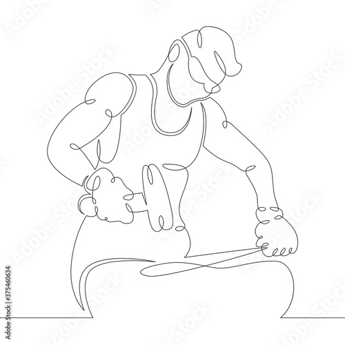 blacksmith with glasses man forges on anvil with a hammer