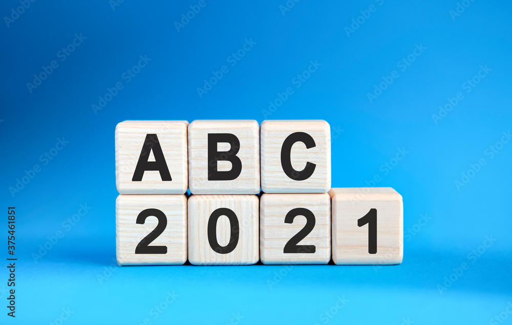 ABC 2021 years on wooden cubes on a blue background ABC 2021 years on wooden cubes on a blue background