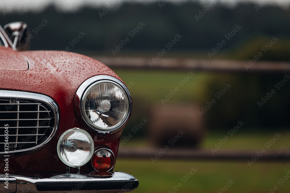 Fototapeta premium Old classic car front headlight