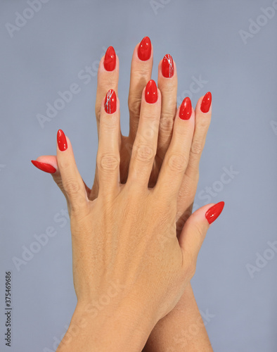 female hands with red manicure