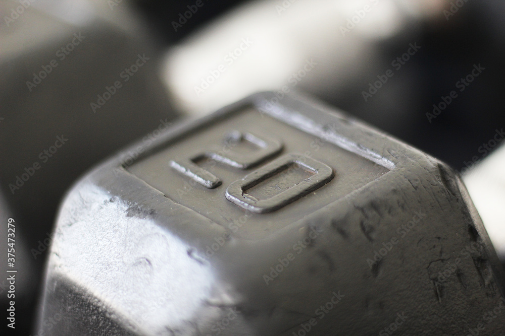 A closeup shot of the '20' on a 20 lb dumbbell A closeup shot of the '20' on a 20 lb dumbbell