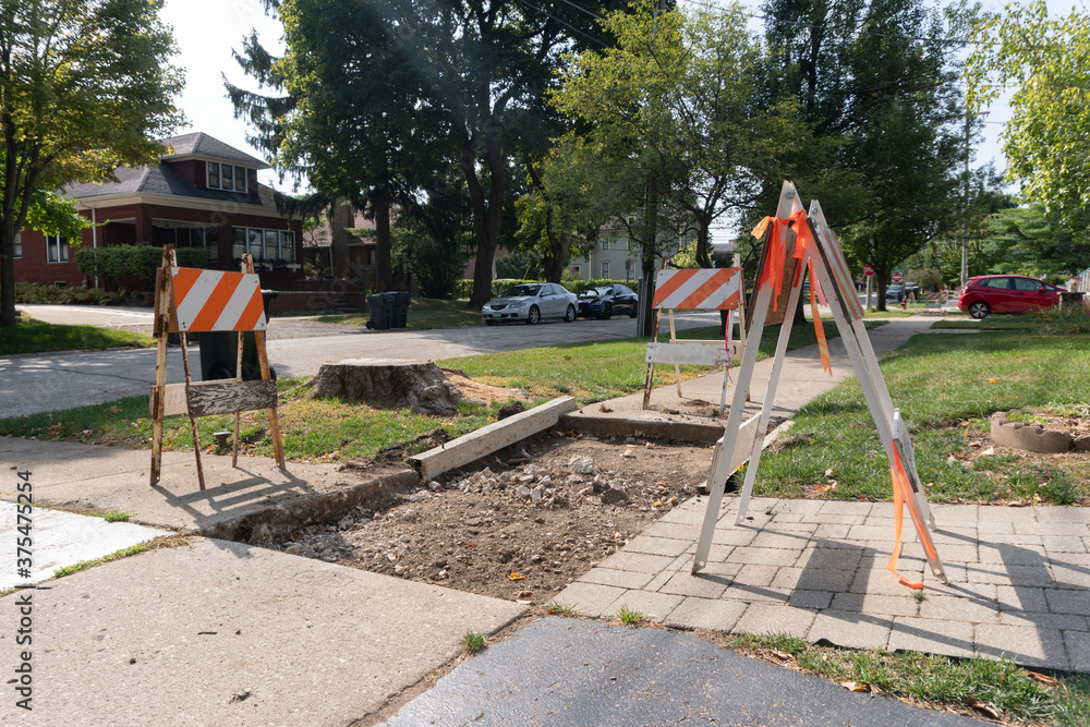 Suburban Neighborhood Sidewalk under Construction Barriers