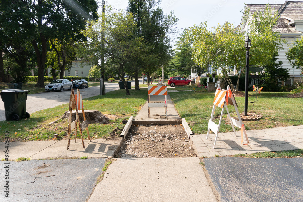Suburban Neighborhood Sidewalk under Construction Barriers Suburban Neighborhood Sidewalk under Construction Barriers