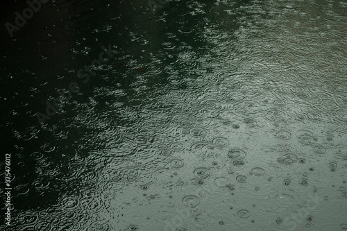 Obraz na plátne Rain drops hitting the surface of salt water pool in the famous house of croatia