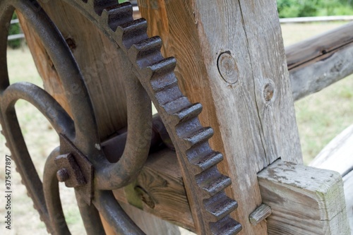 Old, restored, metal crankset with wooden elements.