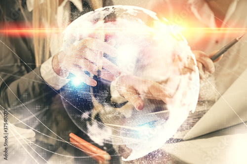 Double exposure of man and woman working together and financial theme hologram. international business concept. Computer background.