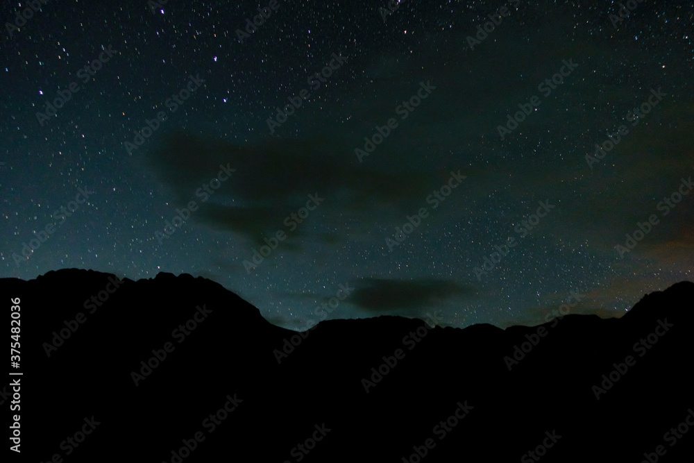 Starry sky and milky way in the mountains.