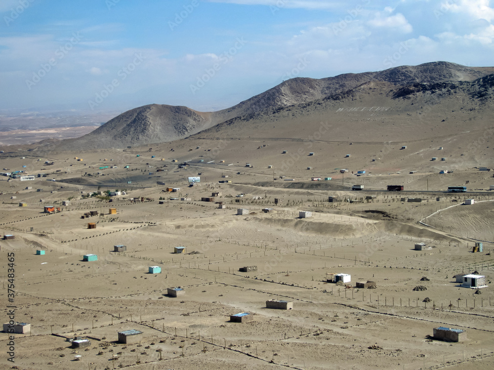 Small and Remote Houses in a Dry and Arid Desert in Nazca, Peru Small and Remote Houses in a Dry and Arid Desert in Nazca, Peru