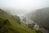 Waterfall path hike from skogar to thorsmork on a rainy cloudy day in august 2020