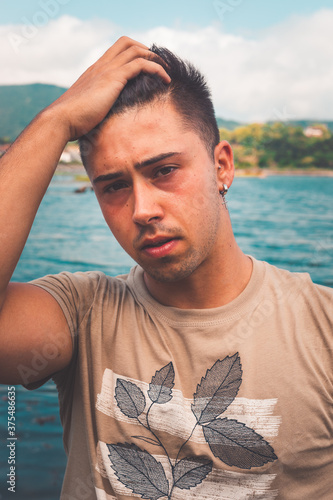 Young man posing at the park.