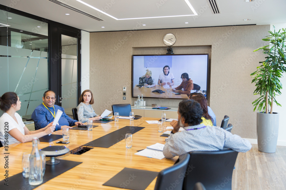 Business people video conferencing in conference room meeting Business people video conferencing in conference room meeting