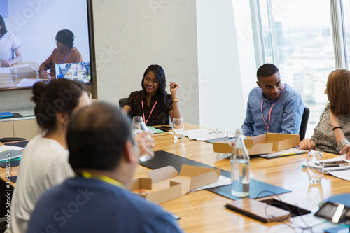 Business people working and eating lunch in conference room meeting