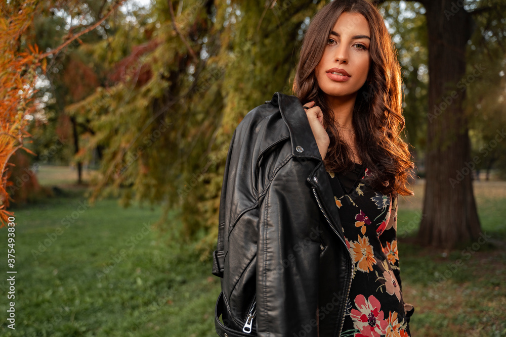 Amazing curly hair brunette with leather jacket , fall fashion girl Amazing curly hair brunette with leather jacket , fall fashion girl