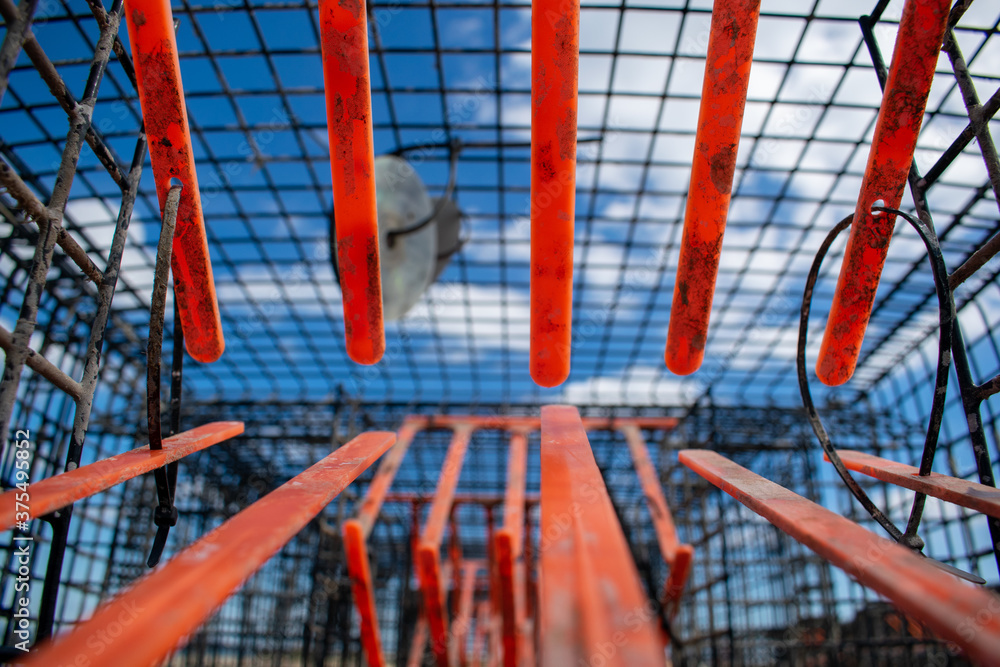 Crab traps orange gateway, dirty cages used to catch large numbers of crabs in Mudeford Quay UK, sea creatures exploitaition, crabs once entered have no way out, closeup of lobster pots inside Crab traps orange gateway, dirty cages used to catch large numbers of crabs in Mudeford Quay UK, sea creatures exploitaition, crabs once entered have no way out, closeup of lobster pots inside