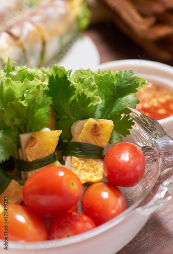 Colorful and healthy salad roll with fresh tomato