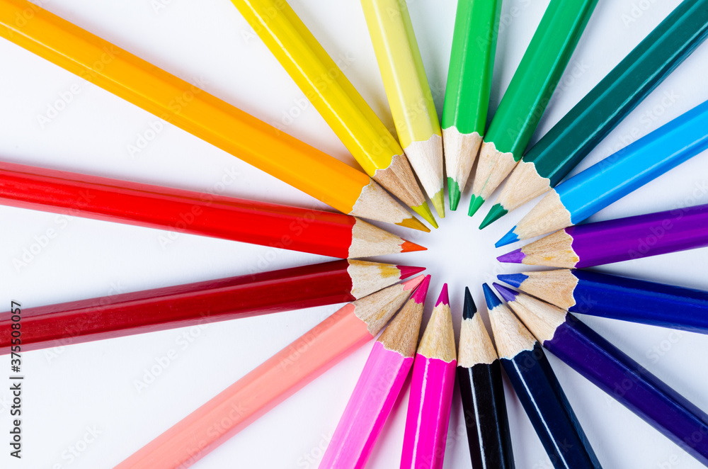 Color wooden pencils in arrange in color wheel colors.